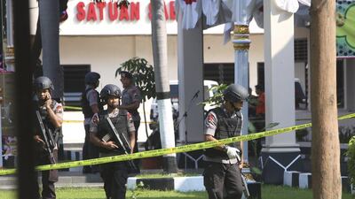 In this July 5, 2016 photo, members of the police bomb squad examine the surrounding area where a suicide bomber blew himself up at the local police headquarters in Solo, Central Java, Indonesia. Experts say the threat from the militants, spread across predominantly Muslim Indonesia, Malaysia and the southern Philippines, should not be underestimated. AP Photo