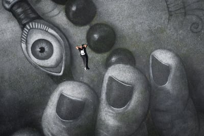 French-Swiss artist Saype photographed against his latest fresco. Valentin Flauraud for Saype