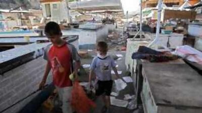Two youths search for food in Osh, the locus of recent ethnic clashes between Uzbek and Kyrgyz factions.