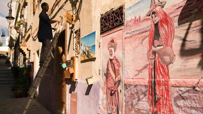 A Moroccan labrouer works on a house in the old part of the port city of Tangiers on September 28, 2016. The residents of Tangiers are working to bring new life to the neglected streets of the Moroccan port's old city.AFP / FADEL SENNA