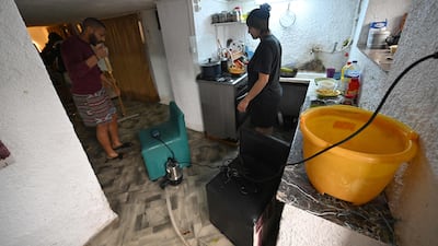 Residents clear up flood damage to their home, in the port of La Goulette, near the capital Tunis. Some regions received the highest rainfall in more than 70 years. AFP
