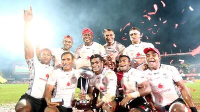 The Fiji team celebrate beating England to win the Cup Final during the Dubai Rugby Sevens tournament on December 5, 2015 in Dubai. Warren Little / Getty Images