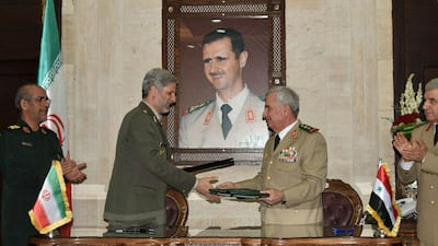 A picture relased by the official Syrian Arab News Agency (SANA) shows Iranian Defence Minister Amir Hatami (L) meeting with his Syrian counterpart Abdullah Ayoub (R) in the capital Damascus. AFP