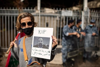 A Lebanese protester demands justice after Slim's assassination. Getty