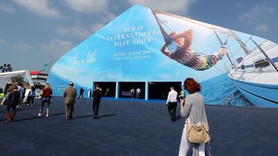 Visitors enjoy the opening day of the Dubai International Boat Show. Pawan Singh / The National