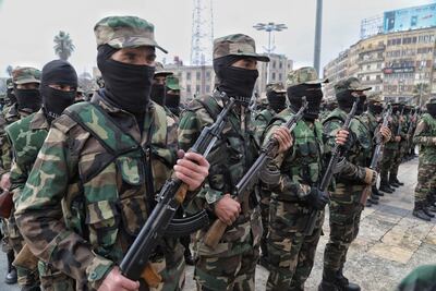 Syrian soldiers take part in a military parade in Aleppo. EPA