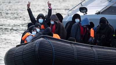 Migrants on board a UK border vessel after being picked up in the English Channel. AFP