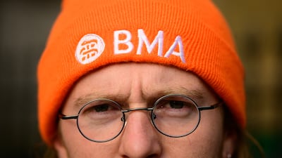 A junior doctor on a picket line outside Whittington Hospital, north London. Getty Images