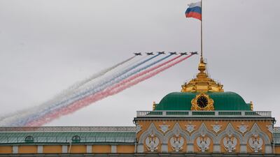 Russian Sukhoi Su-25 assault aircrafts release smoke as they fly over the Kremlin and Red Square in Moscow to mark the 75th anniversary of the victory over Nazi Germany in World War Two. AFP