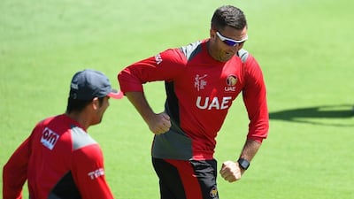 UAE cricket coach Paul Franks, right, having some fun during a final training session ahead of the team's Pool B 2015 Cricket World Cup match against India, in Perth on February 27, 2015. AFP PHOTO / Greg WOOD