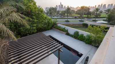 The property has a terrace that overlooks the golf course and the city’s skyline beyond. Courtesy Luxhabitat