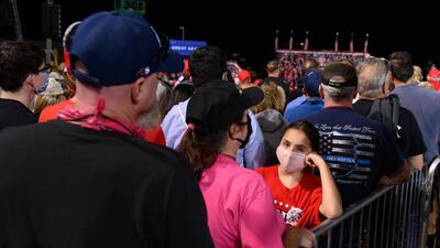 Supporters listen as President Donald Trump speaks at a campaign rally at Atlantic Aviation in Moon Township, Pennsylvania, USA. AFP