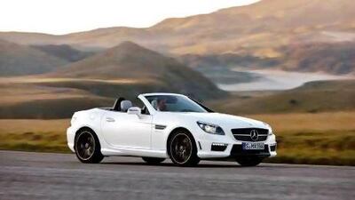 The SLK 55 AMG comes with a retractable folding glass roof that darkens electronically and black wheels that, unfortunately, do not lighten up.