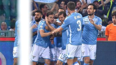 Lazio's Stefan Radu celebrates with teammates after scoring the opener to put his side 1-0 up early in the Coppa Italia final on Wednesday. Ettore Ferrari / EPA