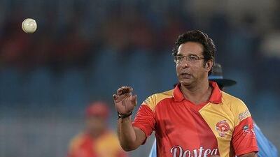 Pakistani director and bowling coach of Islamabad United Wasim Akram prepares to bowl. Aamir Qureshi / AFP