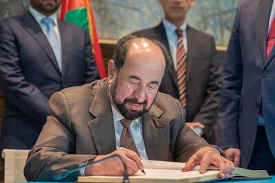 Sheikh Dr Sultan bin Muhammad Al Qasimi writes note at Casa Arabe's VIP registry. Picture: Sharjah Media Office