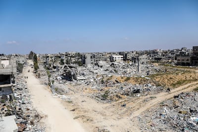 Israeli bombardment has caused destroyed vehicles and roads across Gaza. Getty Images