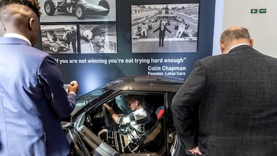 Visitors get a closer look at the cars.