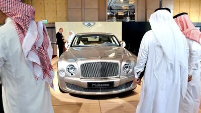 3. Saudi Arabia: Saudi men look at a Bently during a luxury auto show in Riyadh. Fayez Nureldine / AFP