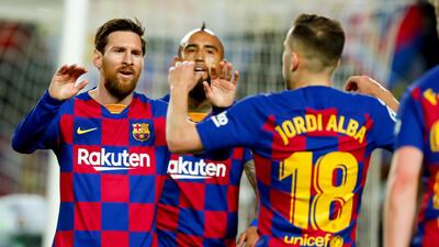 Barcelona's Jordi Alba, right, celebrates with Barcelona's Lionel Messi. AP