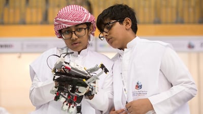 Omar Abdullah, 13, left, and Dawood Saliman, 14, at the World Robot Olympiad. Christopher Pike / The National