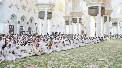 King Hamad bin Isa Al Khalifa of Bahrain, eighth left, and Sheikh Mohammed bin Zayed, Crown Prince of Abu Dhabi and Deputy Supreme Commander of the Armed Forces, ninth left, attend Friday prayers and absentee funeral prayer at the Sheikh Zayed Grand Mosque. They were joined by Sheikh Hamed bin Zayed, Chairman of Crown Prince Court - Abu Dhabi and Managing Director of the Abu Dhabi Investment Authority, third left, Sheikh Mansour bin Zayed, Deputy Prime Minister and Minister of Presidential Affairs, sixth left, Sheikh Hazza bin Zayed, National Security Advisor and Vice Chairman of the Abu Dhabi Executive Council, seventh left, Sheikh Suroor bin Mohammed, tenth left, Sheikh Saif bin Zayed, Deputy Prime Minister and Minister of Interior, twelfth left, Sheikh Diab bin Zayed, thirteenth left, Sheikh Nahyan bin Mubarak, Minister of Culture, Youth and Community Development, fourteenth left, Sheikh Mohammed bin Khalifa, Abu Dhabi Executive Council Member, sixteenth left, and Ahmed Juma Al Zaabi, Deputy Minister of Presidential Affairs, seventeeth left. Ryan Carter / Crown Prince Court - Abu Dhabi