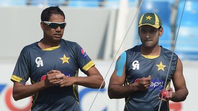 Zulfiqar Babar, left, and Mohammad Hafeez work on their bowling during a net session on Sunday in Dubai ahead of the second Test against New Zealand. Aamir Qureshi / AFP / November 16, 2014