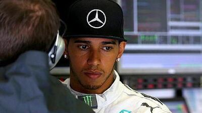 Lewis Hamilton of Great Britain and Mercedes GP looks on in the garage during qualifying ahead of the Belgian Grand Prix at Circuit de Spa-Francorchamps on August 23, 2014 in Spa, Belgium. (Photo by Mark Thompson/Getty Images)