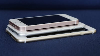 From bottom, the iPhone 6S Plus, 6S and SE lie stacked on one another. Julie Jacobson / AP Photo