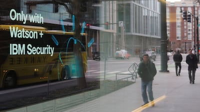 Pedestrians pass a video advertisement for IBM in Massachusetts. Brian Snyder/Reuters