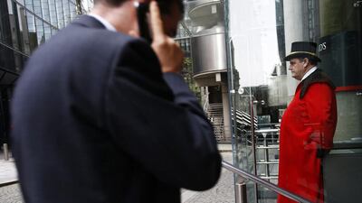 A doorman stands outside Lloyds of London. London’s financial services sector created 25 percent more jobs in February than a year ago, new data has shown. Eddie Keogh / Reuters