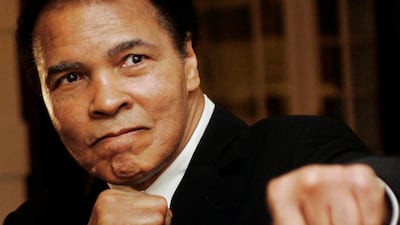 US boxing great Muhammad Ali poses during the Crystal Award ceremony at the World Economic Forum (WEF) in Davos, Switzerland, in this January 28, 2006 file photo. Andreas Meier / Reuters