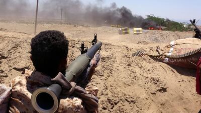 A fighter from of the Southern Transitional Council (STC) watches as a military vehicle, belonging to Saudi-backed government forces, burns during clashes in the Sheikh Salim area in the southern Abyan province. AFP