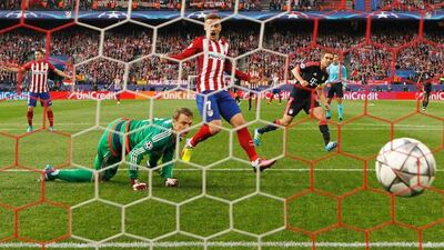 Goalkeeper Manuel Neuer of Bayern Munich fails to stop Saul Niguez of Atletico Madrid (not pictured) as he scores their first goal during the Uefa Champions League semi-final first leg match between Atletico Madrid and FC Bayern Munich at Vincente Calderon on April 27, 2016 in Madrid, Spain. (Photo by Alexander Hassenstein/Bongarts/Getty Images)