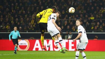 Pierre-Emerick Aubameyang of Borussia Dortmund outjumps Ben Davies of Tottenham Hotspur as he scores their first goal during the UEFA Europa League Round of 16 first leg match between Borussia Dortmund and Tottenham Hotspur at Signal Iduna Park on March 10, 2016 in Dortmund, Germany. (Photo by Alex Grimm/Bongarts/Getty Images)