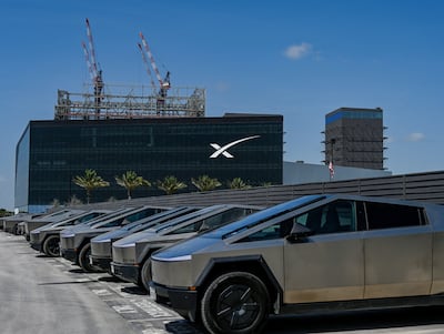 A fleet of Tesla Cybertrucks at charging stations outside the SpaceX launch production centre at Starbase, Texas. Reuters