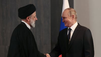Russian President Vladimir Putin shakes hands with Iranian President Ebrahim Raisi during a meeting on the sidelines of the Shanghai Co-operation Organisation summit in Uzbekistan. Reuters
