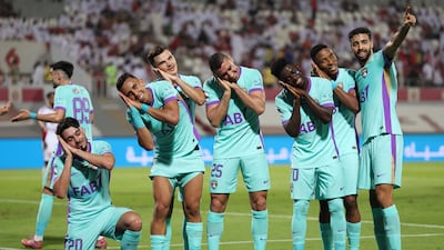 Rami Rabia celebrates with Al Ain teammates after scoring against Sharjah