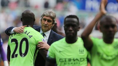 Manuel Pellegrini, second left, will leave his job at Manchester City on June 30, 2016. Geoff Caddick / AFP