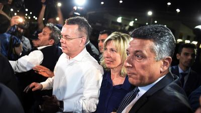 Pastor Andrew Brunson, center left, and his wife Norine Brunson arrive at Adnan Menderes airport for a flight to Germany after his release following his trial in Izmir, Turkey. AP