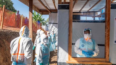 Health workers stand in an Ebola treatment center in Bunia, in north-east Democratic Republic of the Congo. AFP
