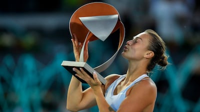 Aryna Sabalenka holds the Madrid Open trophy after defeating Iga Swiatek in the final. AP