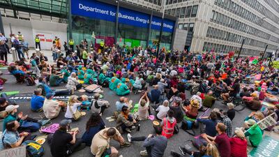 Extinction Rebellion demonstrators block the road in Victoria Street outside the Department for Business, Energy and Industrial Strategy in London. EPA