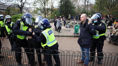 Police officers detain protestors during an anti-lockdown demonstration amid the coronavirus disease (COVID-19) outbreak in London. Reuters