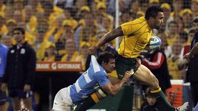 Argentina's Marcelo Bosch tries to bring down Australia's Ben Tapuai during their Rugby Championship encounter.