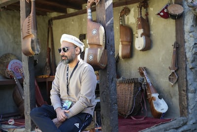 Pakistani producer Xulfi, co-founder of the Humnava music project, in Hunza surrounded by traditional string instruments. Photo: Nidhi Khanduri