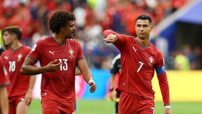 Portugal's Cristiano Ronaldo talks to Renato Veiga at half time against the Democratic Republic of the Congo, in Houston. Reuters