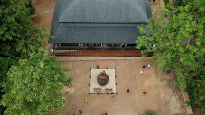 This aerial picture shows visitors exploring the visitor centre for the Tham Luang cave. AFP