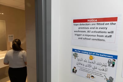 A warning side outside a school bathroom. Antonie Robertson / The National