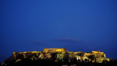 The ancient Acropolis hill, with the ruins of the fifth century BC Parthenon temple, is seen after sunset in central Athens. Petros Karadjias / AP Photo
